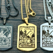 Three dog tag necklaces with 'The Flyfisher' design on a wooden surface.