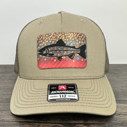 Beige hat with a brook trout printed patch with a trout laser engraved on the patch