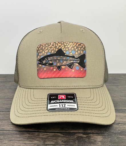Beige hat with a brook trout printed patch with a trout laser engraved on the patch