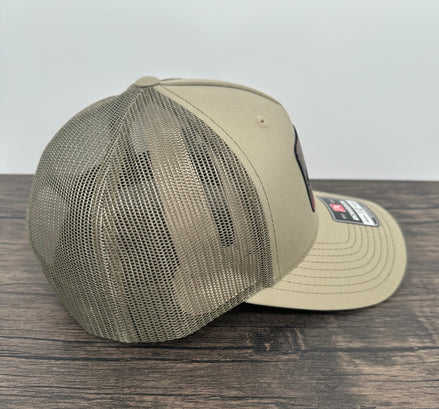 Side view of a beige fly fishing brook trout hat