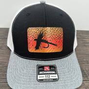 Black gray and white hat with a cutthroat trout fly patch