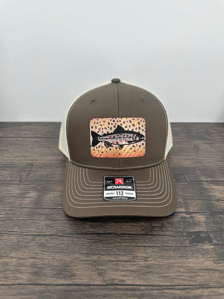 Brown and beige brown trout fly fishing hat featuring a laser engraved trout outline on a printed brown trout patch