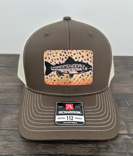 Brown and beige brown trout fly fishing hat featuring a laser engraved trout outline on a printed brown trout patch