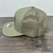 Loden green hat side view of the moose wearing sunglasses patch hat