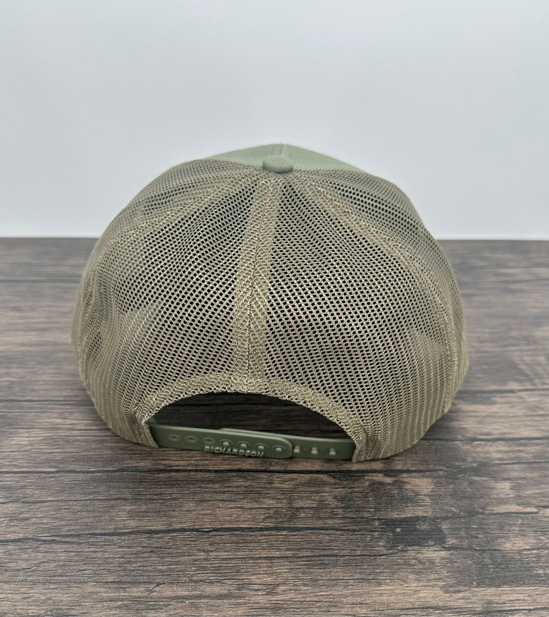 Loden green hat back view of the moose wearing sunglasses patch hat