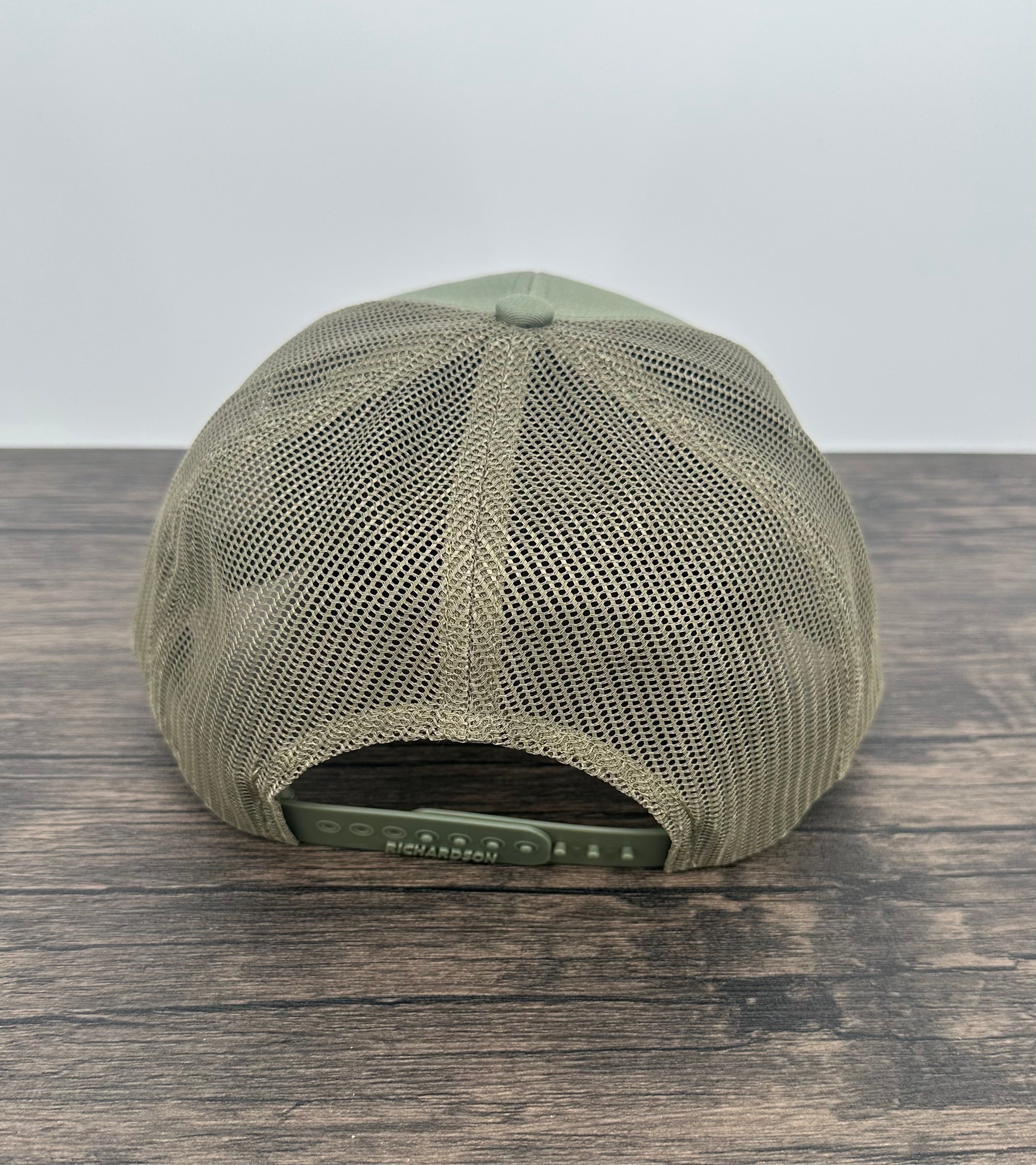 Loden green hat back view of the moose wearing sunglasses patch hat