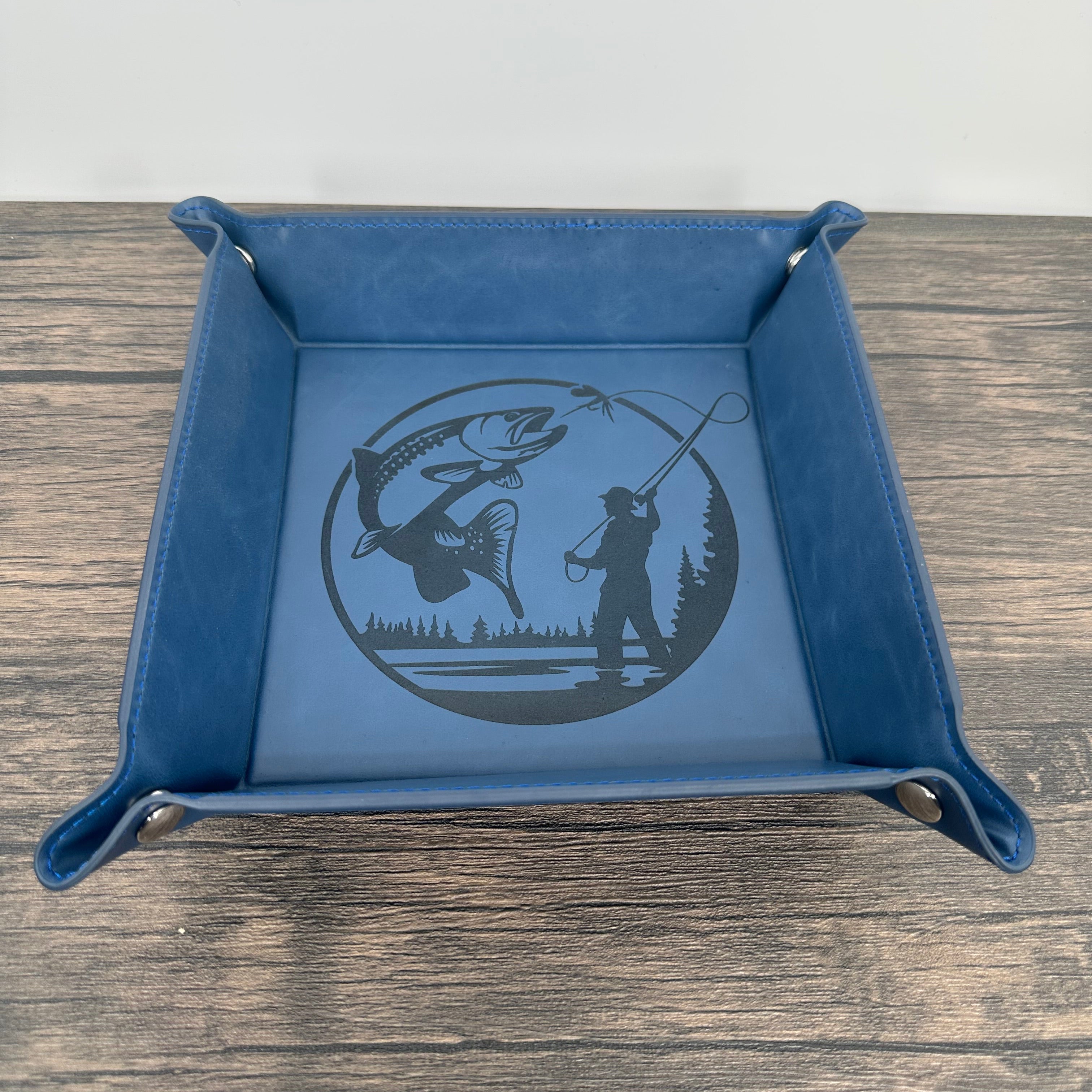 Blue leatherette fly fishing valet tray with a trout and a fly fisherman laser engraved