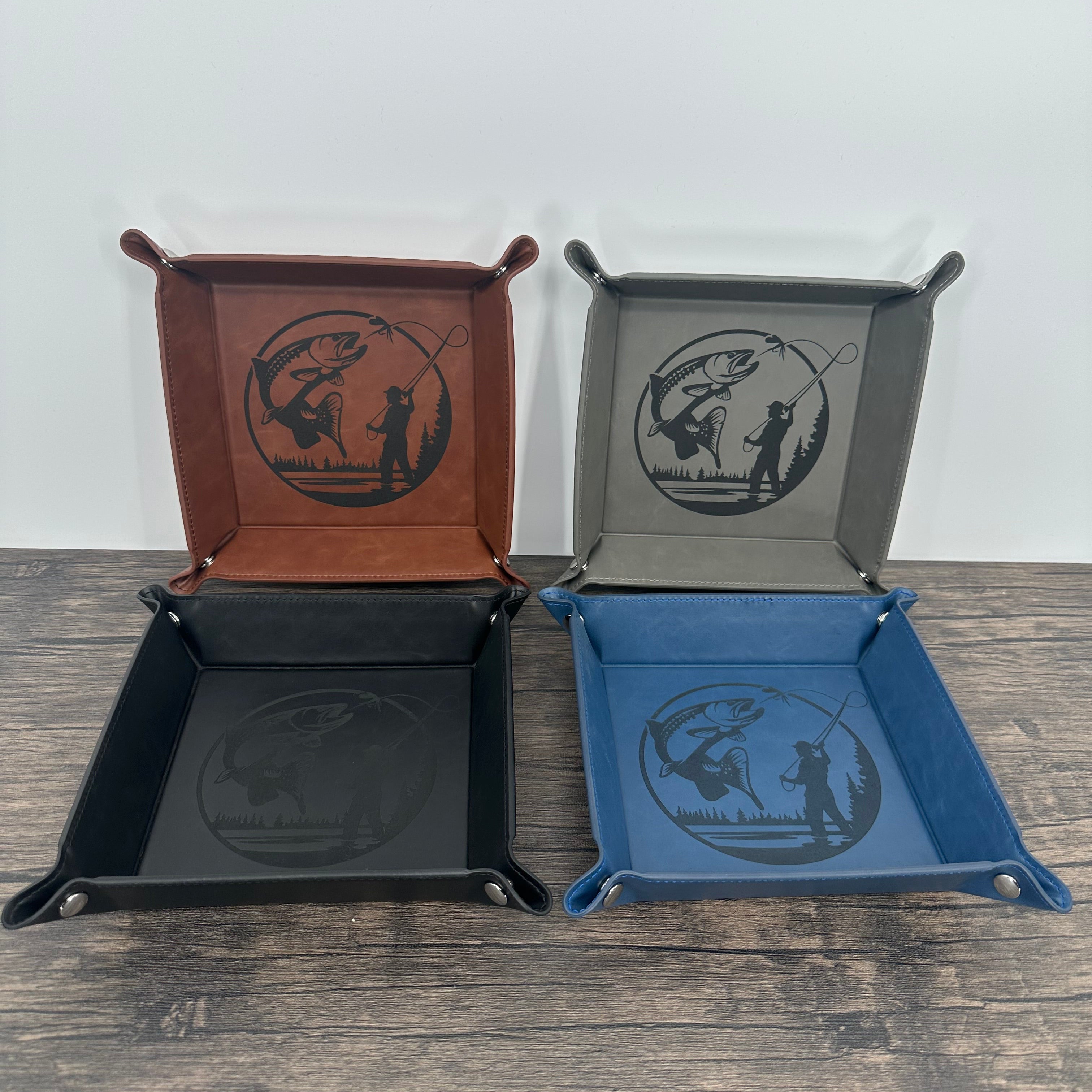 Fly fishing laser engraved trout and fly fisherman valet tray showing 4 colors brown, grey, blue and black