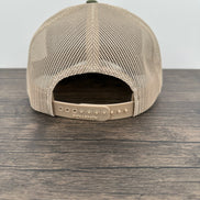 Back view of a Green and beige trucker hat with moose  wearing a beanie and sunglasses that has been laser engraved on a leatherette patch on the front of the hat