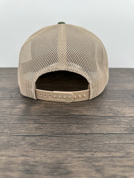 Back view of a Green and beige trucker hat with moose  wearing a beanie and sunglasses that has been laser engraved on a leatherette patch on the front of the hat
