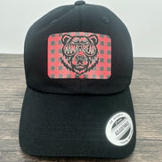 Black hat with a red and black buffalo plaid patch that has mama bear engraved on the patch