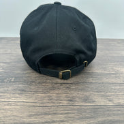 Back view of a Black hat with a red and black buffalo plaid patch that has mama bear engraved on the patch