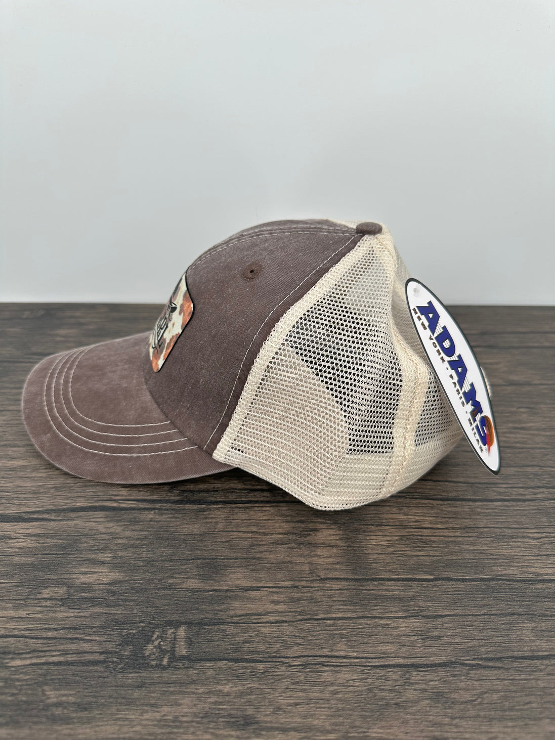 Side view of a Hat with Cow Print Cowgirl Patch