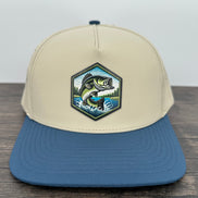 Beige and blue cap with a jumping bass fish patch 