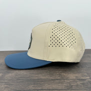 Beige and blue cap with a bass fish patch side view