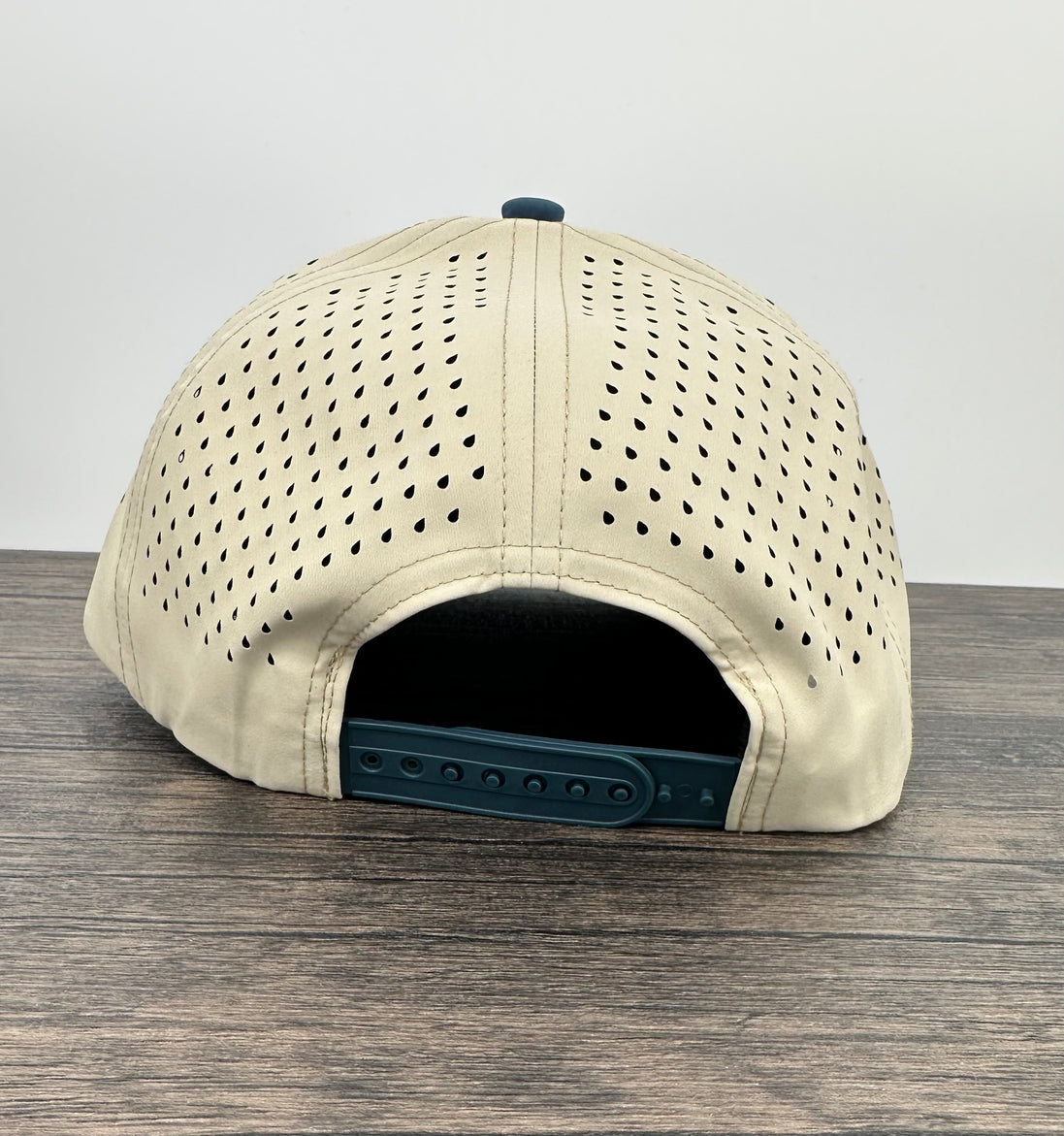 Back view of the sand and blue hat with jumping bass patch