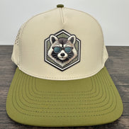 Beige and green cap with raccoon design