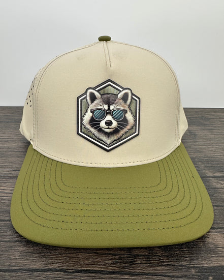 Beige and green cap with raccoon design