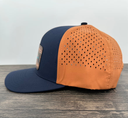 Navy and orange fly fishing cap side view