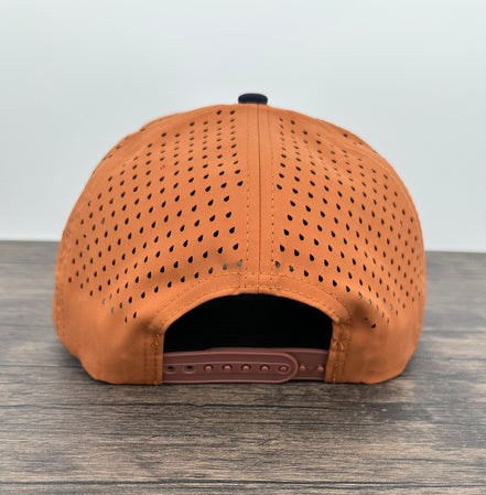 Back view of the navy and orange fly fishing trout patch hat
