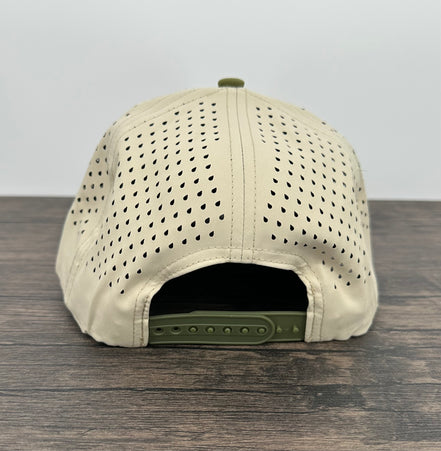 Beige cap with green brim on a wooden surface