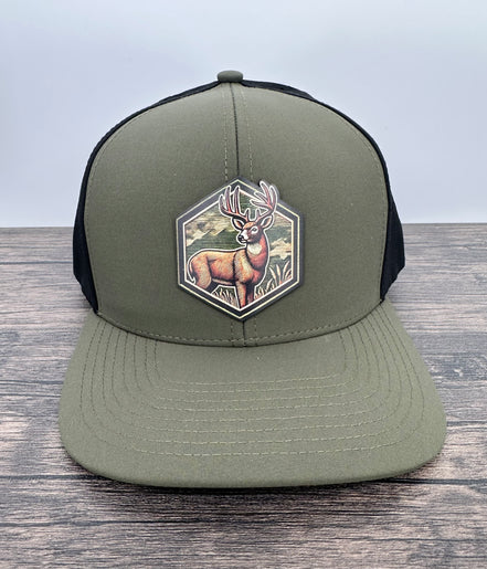 Green and black cap with a deer patch