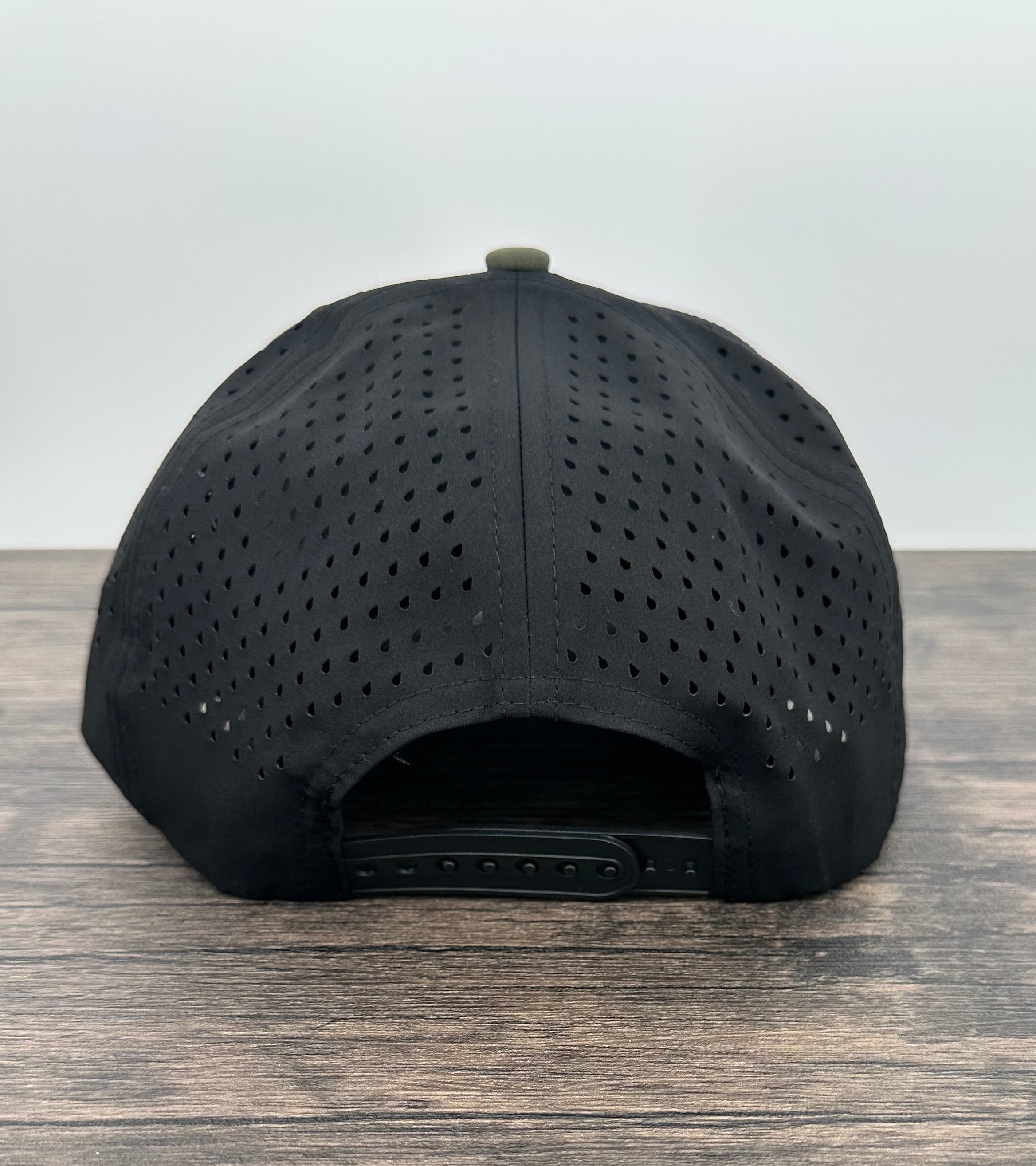 Back view of a green and brown deer hunting hat