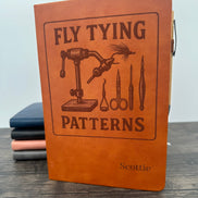 Brown leatherette notebook with 'Fly Tying Patterns' design and  engraved name on the cover of the journal