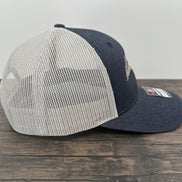 Side view of a denim navy embroidered fly fishing hat
