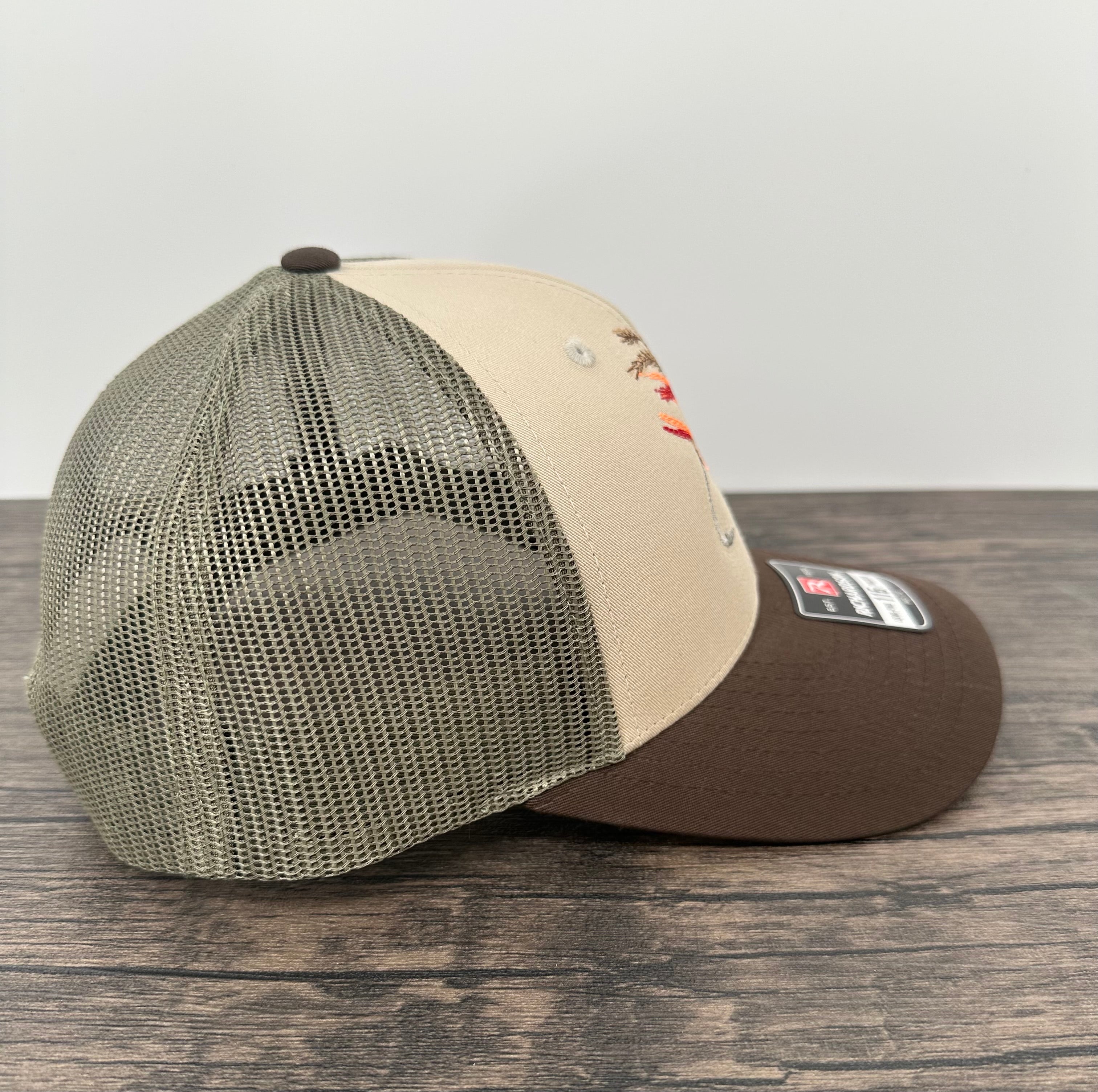 Side view of an embroidered fly fishing hat
