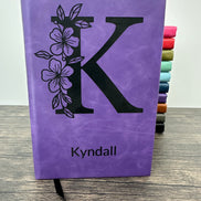 Purple laser engraved journal with floral design and 'Kyndall' engraved on the cover