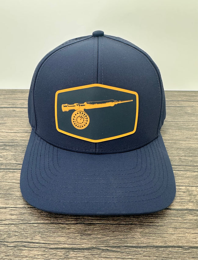 Navy Blue 6-panel hat with a fly fishing fly rod and reel patch