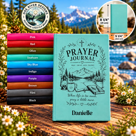 A personalized turquoise Prayer Journal with black line art of a mountain lake scene and the name 'Danielle' at the bottom, displayed on a wooden surface outdoors. A stack of colored journal covers appears to the left, a circular inset shows the journal closed with dimensions, and a 'Don River Designs' logo appears at the top left.