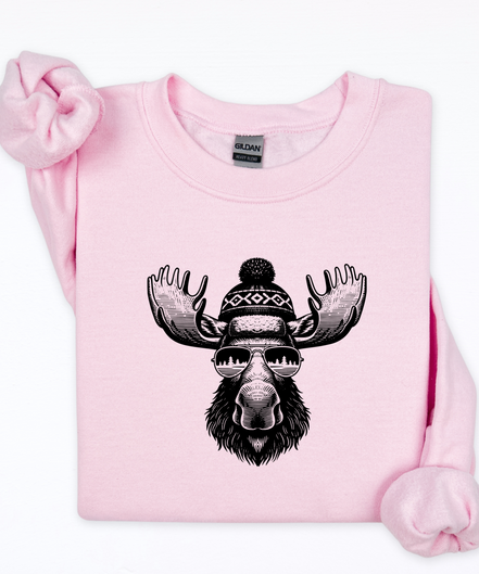 Pink sweatshirt with a moose graphic wearing sunglasses and a beanie on a white background