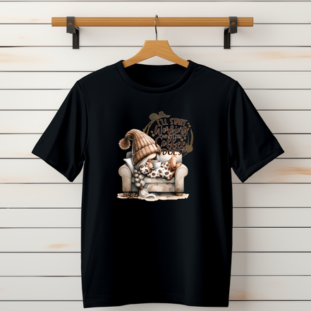 Black shirt with gnome holding coffee and text that reads I’ll start working when my coffee does