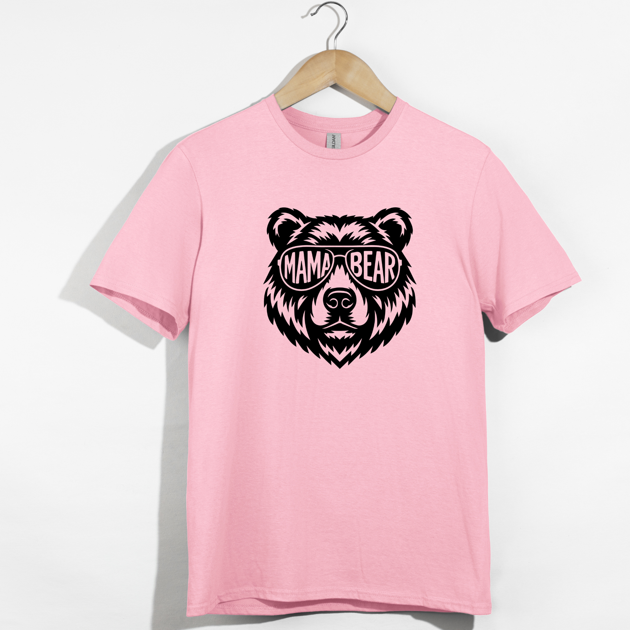 Pink t-shirt with a black bear graphic and 'MAMA BEAR' text 