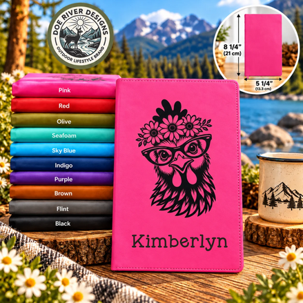 A bright pink personalized tablet case with a black engraved rooster design and placeholder text, displayed in front of a stack of other color options. The background shows a scenic mountain landscape, with a circular inset showing the tablet dimensions and the Dog River Designs logo in the top left.