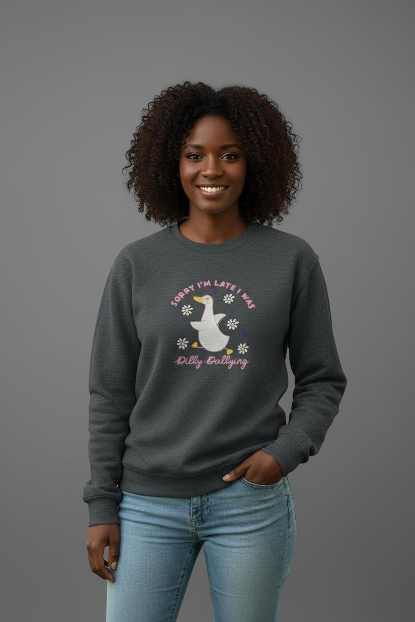 Black female model wearing charcoal gray sweatshirt with simple background