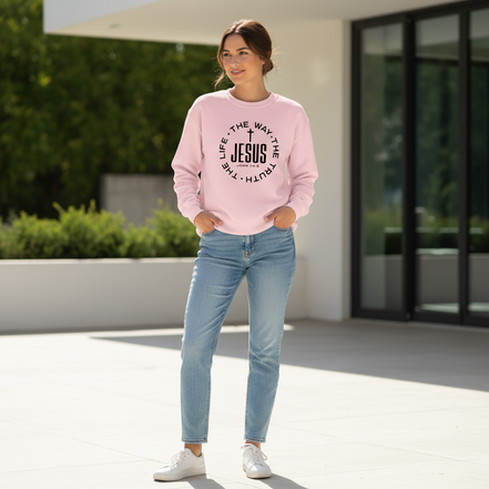 Female model wearing Gildan light pink Jesus sweatshirt without coffee cup