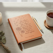Grief Journal in brown with a cup of coffee and candle