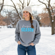Model wearing grey Freezin' Season sweatshirt