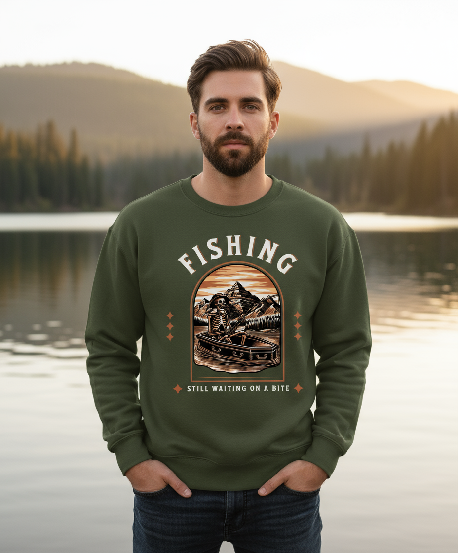 Model wearing military green fishing sweatshirt in lake setting