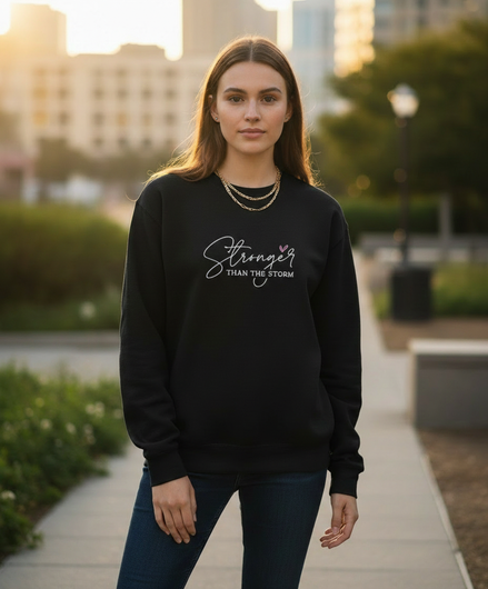Model wearing Stronger Than The Storm sweatshirt in black