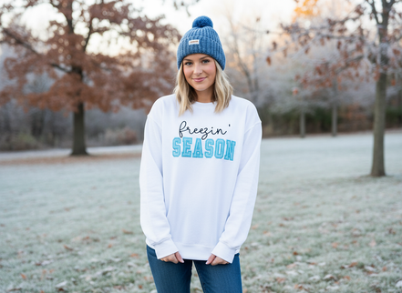 Model wearing white Freezin' Season sweatshirt