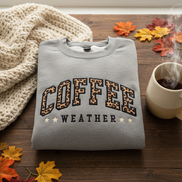 Sport grey Coffee Weather sweatshirt folded with cozy background
